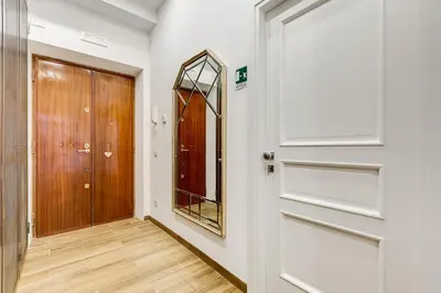 a hallway with a door and a mirror at Roma in Relax Lovely Loft in the center of Rome Fabrizia in Rome
