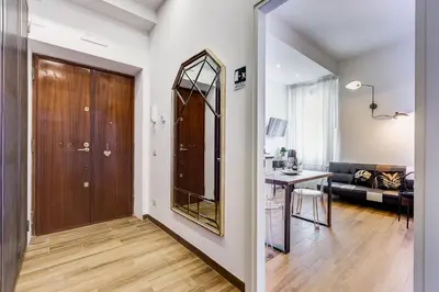a hallway with a door and a table in a room at Roma in Relax Lovely Loft in the center of Rome Fabrizia in Rome