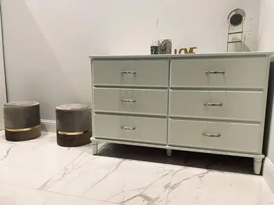a white dresser in a room with two stools at Vatican Tiny House in Rome