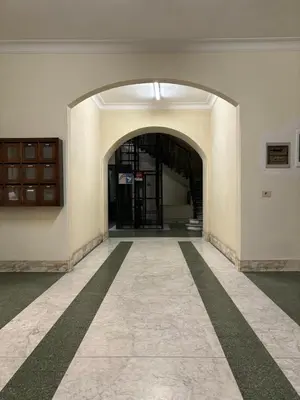 an empty hallway with an entrance to a building at Vatican Tiny House in Rome