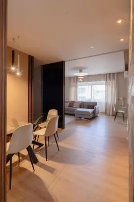 a living room with a table and chairs and a couch at Saint Peter Vatican luxury apartment in Rome