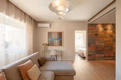 a living room with a couch and a bed at Saint Peter Vatican luxury apartment in Rome
