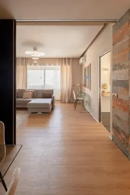 a living room with a couch and a table at Saint Peter Vatican luxury apartment in Rome