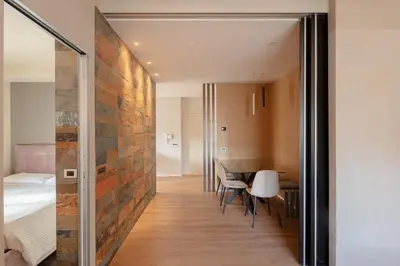 a room with a bed and a table and chairs at Saint Peter Vatican luxury apartment in Rome