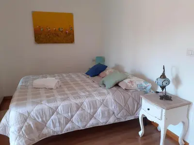a bedroom with a bed and a table with a lamp at Loft Shabby Chic con vista vicino al Vaticano in Rome