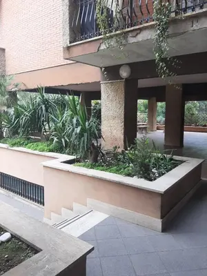 a building with a courtyard with plants in it at Loft Shabby Chic con vista vicino al Vaticano in Rome