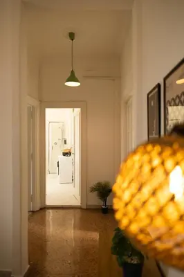 a hallway with a door leading to a room at Porto Fluviale Penthouse - Rome Collection in Rome