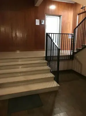 a staircase in a building with a door and a window at 3 FERMATE DAL COLOSSEO - Casa Vacanze Elena - 50 m da METRO GARBATELLA in Rome