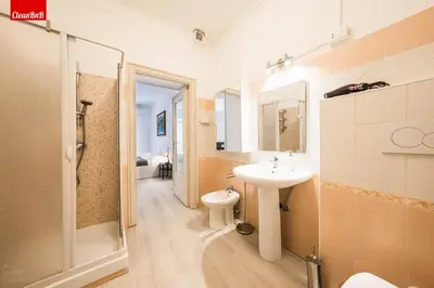 a bathroom with a sink and a shower and a toilet at GuestHost - La finestra sui palazzi di Roma Apartment in Rome