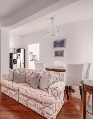 a living room with a couch and a table at Vatican Museum Apartment - ZENO 26 in Rome