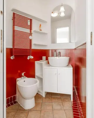 a bathroom with a white sink and a toilet at Vatican Museum Apartment - ZENO 26 in Rome