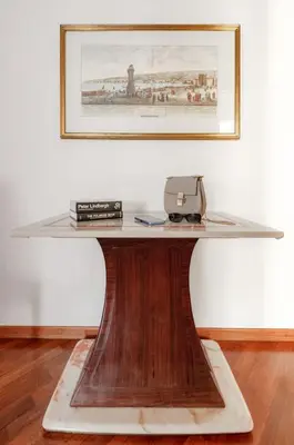 a table with a glass top on top of it at Vatican Museum Apartment - ZENO 26 in Rome