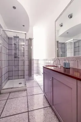 a large bathroom with a shower and a sink at Vatican Museum Apartment - ZENO 26 in Rome