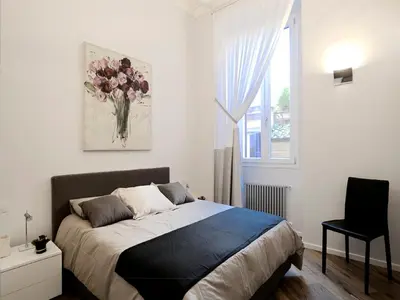 a bedroom with a bed and a window at Antiche Residenze Romane Navona in Rome