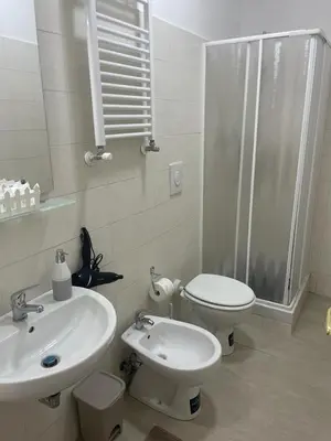 a bathroom with a sink and a toilet and a shower at BORGO PESCI in Rome