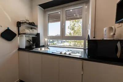a kitchen with a sink and a window at Casa Felicita in Rome
