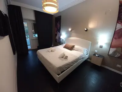 a bedroom with a bed with two towels on it at Casa Felicita in Rome