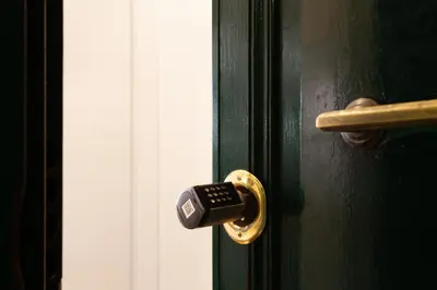 a black door with a lock on it at Trevi Apartment in Rome