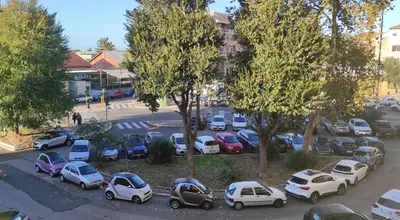 a group of cars parked in a parking lot at La Casa di Dany in Rome