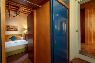 a hallway with a door leading to a bedroom at Dimora degli Acetari in Rome