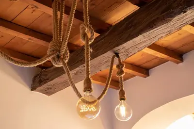 a chandelier with lights hanging from a ceiling at Dimora degli Acetari in Rome
