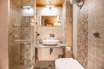 a bathroom with a toilet and a sink and a shower at Dimora degli Acetari in Rome