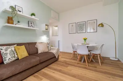 a living room with a couch and a table at BND Boutique Gemelli Vaticano in Rome
