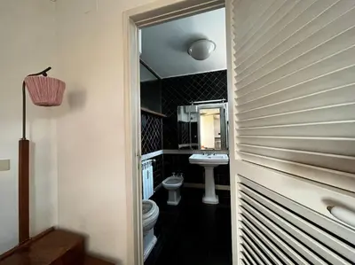 a bathroom with a toilet and a sink at Open space Apartment in Prati in Rome