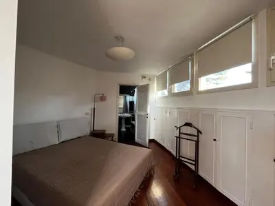 a bedroom with a large bed and a window at Open space Apartment in Prati in Rome