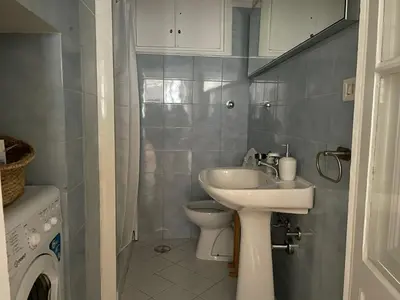 a small bathroom with a sink and a toilet at Prope Vaticanum in Rome