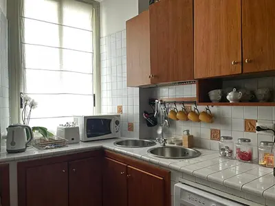 a kitchen with a sink and a microwave at Prope Vaticanum in Rome