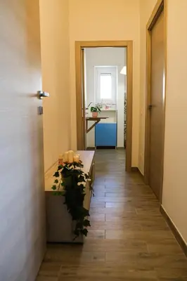 a hallway with a table and a desk in a room at LE TRIPLETTE in Rome