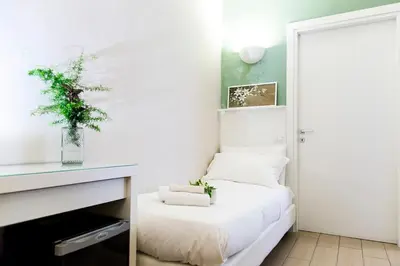 a bedroom with a bed with a plant on it at B&B Casetta Roma in Rome