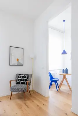 a living room with two chairs and a table at Little Gaia Suite in Rome