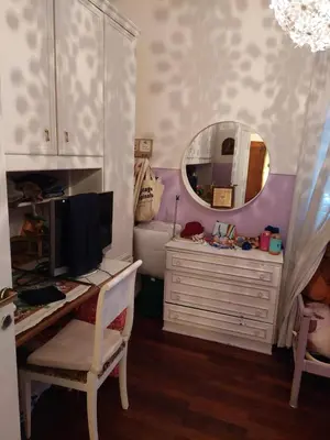a room with a desk with a computer and a mirror at Appartamento con giardino in zona Ponte Milvio e Stadio Olimpico in Rome