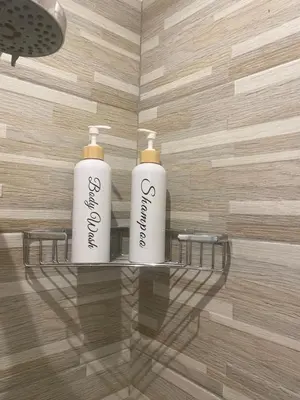 two white towels on a shelf in a bathroom at Residenza Bernini in Rome