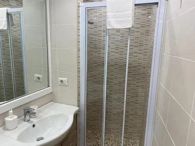 a bathroom with a shower and a sink at Residenza Bernini in Rome
