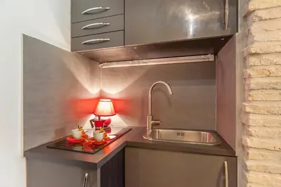 a kitchen with a sink and a lamp on a counter at ANTICA DIMORA FARNESE in Rome