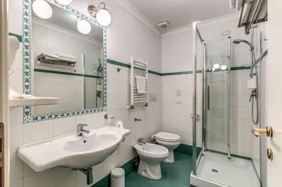 a bathroom with a sink and a toilet and a shower at Aurelius Ponte Sant'Angelo in Rome