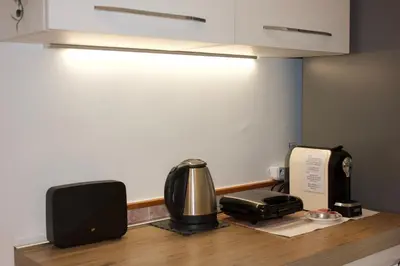 a kitchen counter with a coffee maker and a phone at A 200Metri Dal Vaticano, 2 Camere Da Letto in Rome