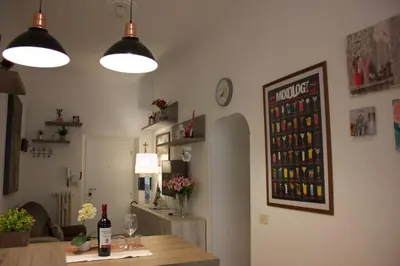 a room with a table with wine bottles on the wall at A 200Metri Dal Vaticano, 2 Camere Da Letto in Rome