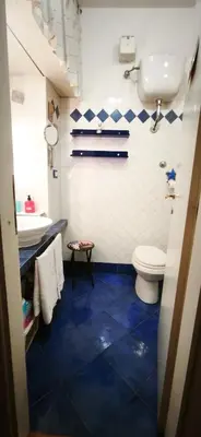 a bathroom with a toilet and a sink at Lovely studio near the Colosseum in Rome
