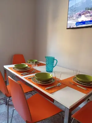 a dining room table with plates and glasses on it at La CASA DI SABINA in Rome