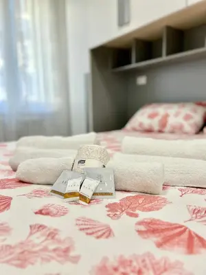 a bed with two beds with towels on it at Roma Apartment holiday in Rome