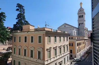 a building with a clock tower on top of it at Piccola Piazza Della Libertà in Rome