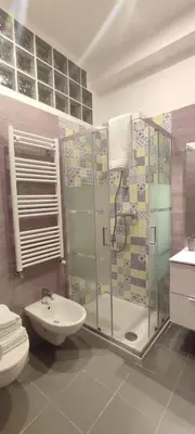 a bathroom with a shower and a sink and a toilet at Portonaccio suite - Stazione Tiburtina - Università - Metro B in Rome