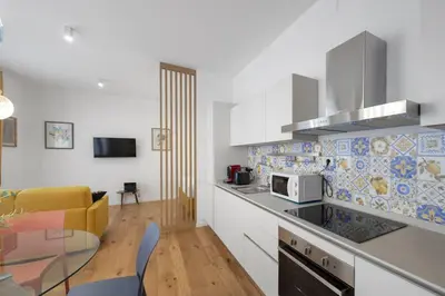 a kitchen with a table and a counter top at Vatican Steps, Suite Mary, Strollingrome in Rome