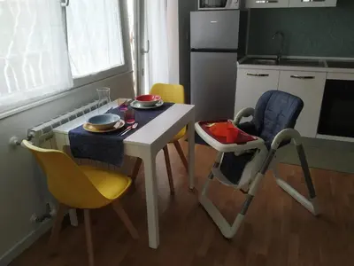 a small kitchen with a table and chairs and a table and a table and chairs at Casa con Giardino - Metro A Cornelia Vaticano a sole 4 fermate in Rome