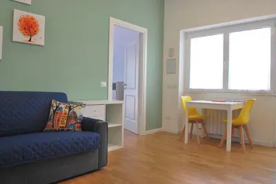 a living room with a couch and a table at Casa con Giardino - Metro A Cornelia Vaticano a sole 4 fermate in Rome