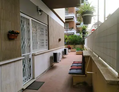 a hallway of a building with pillows on the ground at Casa con Giardino - Metro A Cornelia Vaticano a sole 4 fermate in Rome